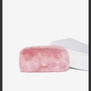 Split hairs faux fur clutch